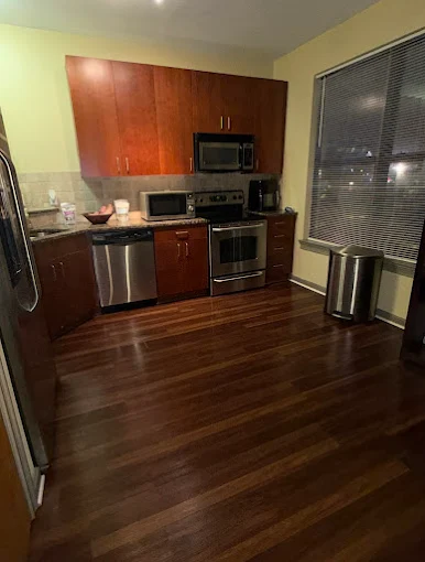 Clean kitchen with polished hardwood floors